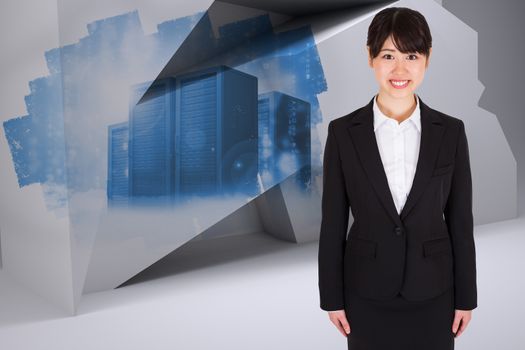 Smiling businesswoman against abstract screen in room showing server towers