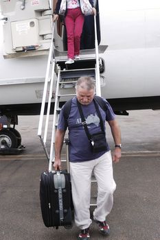 Disembarking passengers of an airliner company Air Burkina in Ouagadougou airport