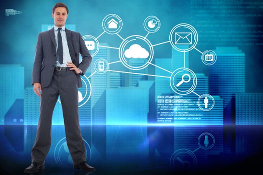 Serious businessman with hand on hip against futuristic technology interface