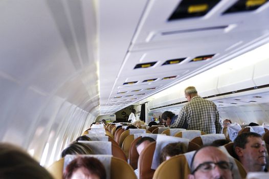 Within a commercial airliner of Air Burkina full-flight to the airport in Ouagadougou Burkina Faso