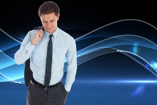 Smiling businessman holding his jacket against blue technology background