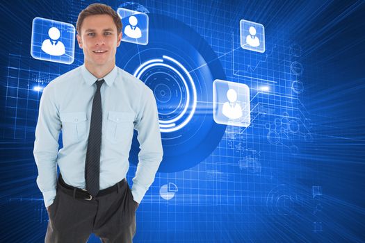 Happy businessman standing with hands in pockets against futuristic technology interface