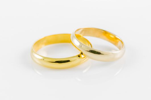 pair wedding golden ring on a white background