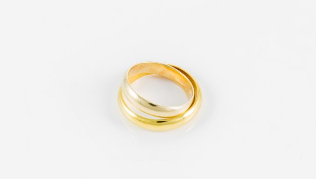 pair wedding golden ring on a white background