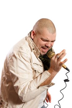Rock singer sings into a microphone on white background