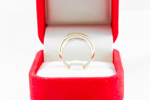 pair ring in a gift red box on white background