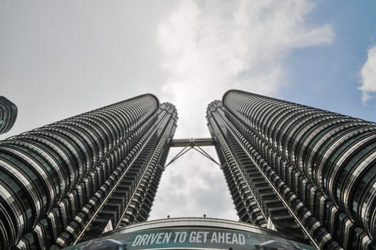 KUALA LUMPUR - APRIL 10: General view of Petronas Twin Towers on Apr 10, 2011 in Kuala Lumpur, Malaysia. The towers are the worlds tallest twin towers with the height of 451.9m.