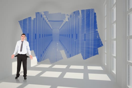 Businessman with empty pockets against abstract screen in room showing server hall