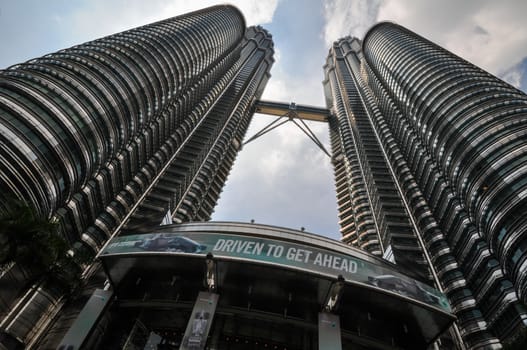 KUALA LUMPUR - APRIL 10: General view of Petronas Twin Towers on Apr 10, 2011 in Kuala Lumpur, Malaysia. The towers are the worlds tallest twin towers with the height of 451.9m.