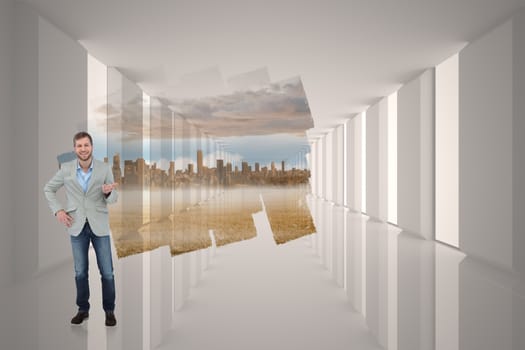 Stylish man smiling and gesturing against abstract screen in room showing cityscape