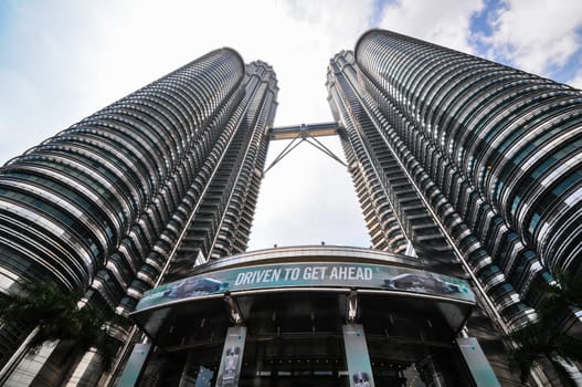 KUALA LUMPUR - APRIL 10: General view of Petronas Twin Towers on Apr 10, 2011 in Kuala Lumpur, Malaysia. The towers are the worlds tallest twin towers with the height of 451.9m.