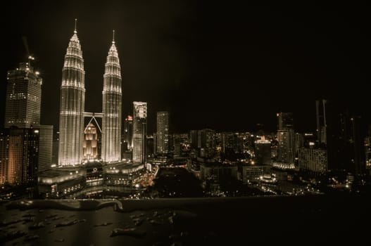 KUALA LUMPUR - APRIL 10: General view of Petronas Twin Towers  at night on Apr 10, 2011 in Kuala Lumpur, Malaysia. The towers are the worlds tallest twin towers with the height of 451.9m.