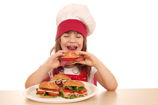 hungry little girl cook eating sandwich 