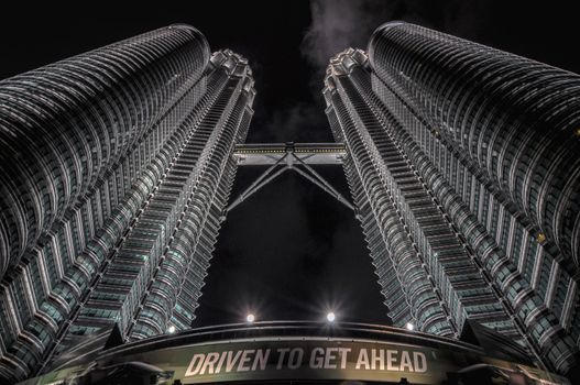 KUALA LUMPUR - APRIL 10: General view of Petronas Twin Towers  at night on Apr 10, 2011 in Kuala Lumpur, Malaysia. The towers are the worlds tallest twin towers with the height of 451.9m.