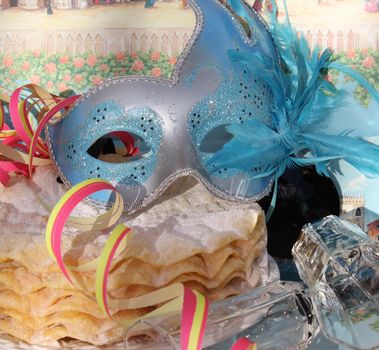 Blue glitter mask and pancakes for carnival