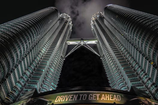 KUALA LUMPUR - APRIL 10: General view of Petronas Twin Towers  at night on Apr 10, 2011 in Kuala Lumpur, Malaysia. The towers are the worlds tallest twin towers with the height of 451.9m.