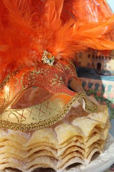 Orange carnival mask with pancakes