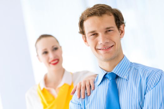 Businessman receiving congratulations from his colleagues in the leadership team work