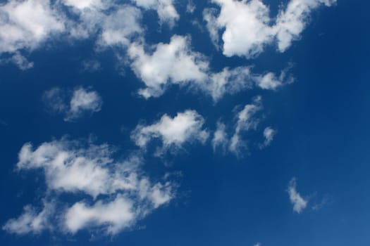 The white clouds in the blue sky