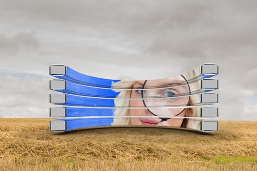 Blonde with magnifying glass on abstract screen against cloudy countryside background