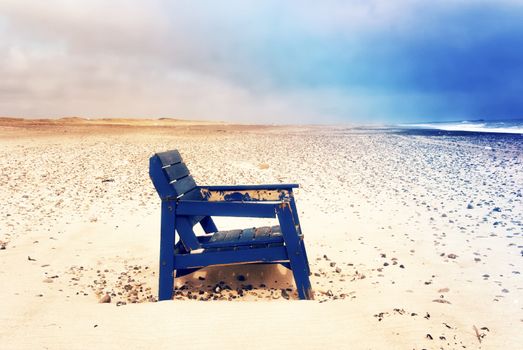 A stranded chair on the beach in Denmark