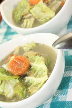 Savoy cabbage stew in bowls on a light background