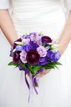 hands on wedding bouquet