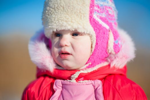 child in winter day outdoors
