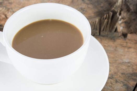 Close up hot coffee drink on wood background