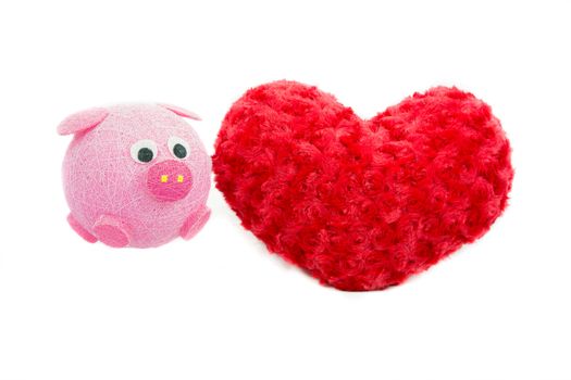 Valentine Heart Made Out of Pillow Roses and Pink Pig on White Background