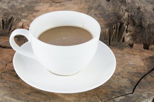 Close up hot coffee drink on wood background