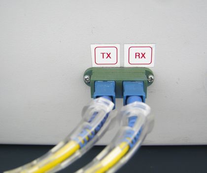 Optic fiber communications equipment installed in a large datacenter.