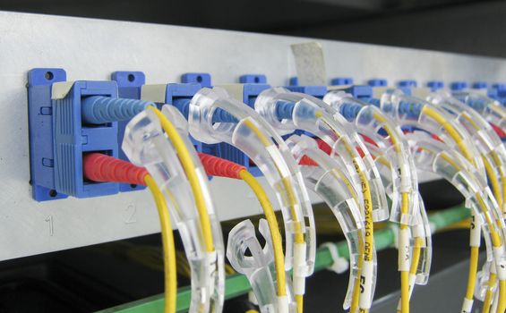 Optic fiber communications equipment installed in a large datacenter.