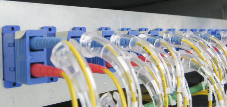 Optic fiber communications equipment installed in a large datacenter.