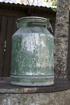 Large old metal milk can