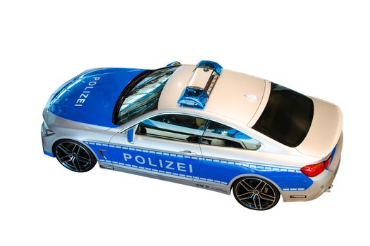 MUNICH, GERMANY - DECEMBER 27, 2013: New model 2014 of German police patrol car, presented in BMW welt show. Isolated on white.