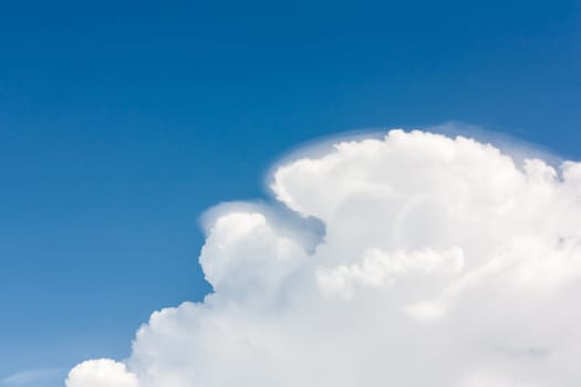 The white clouds background in blue sky