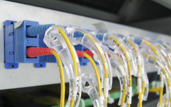 Optic fiber communications equipment installed in a large datacenter.