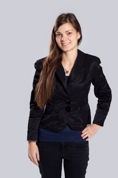 Young long-haired woman without makeup posing in costume