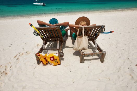 Couple in green on a tropical beach at Maldives