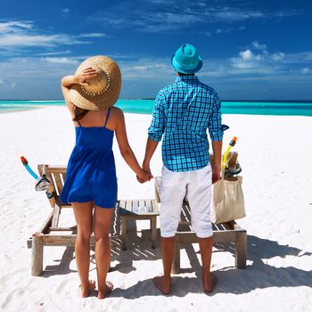 Couple in blue on a tropical beach at Maldives