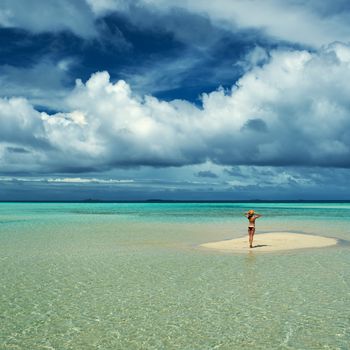 Woman in bikini at tropical beach