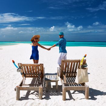 Couple in blue on a tropical beach at Maldives