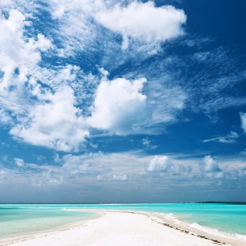 Beautiful island beach with sandspit at Maldives