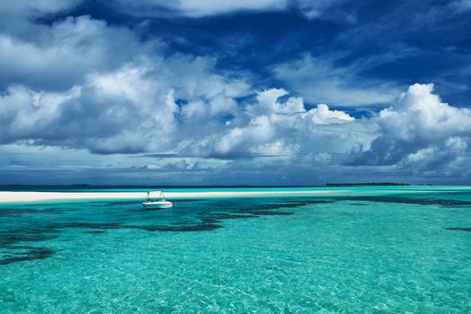 Beautiful island beach with sandspit at Maldives