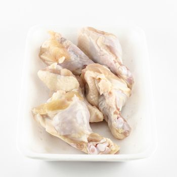 food fresh chicken in foam isolated on white background