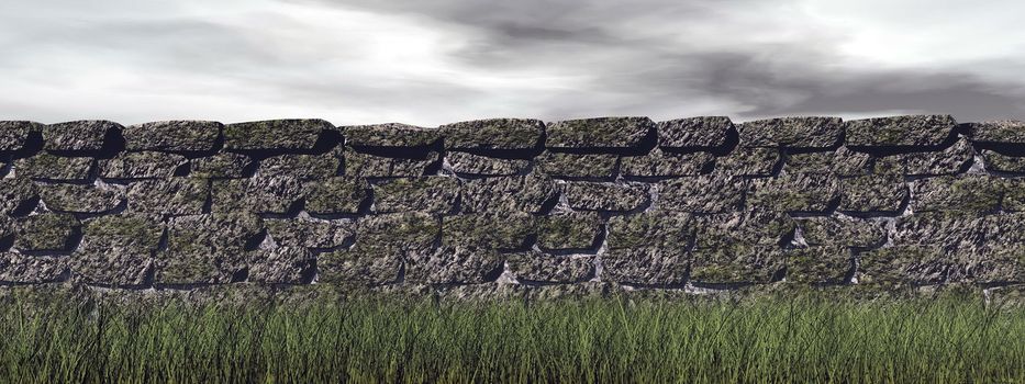 Long brick wall upon green grass in grey cloudy sky background