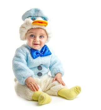 Baby in duck suit posing at camera on white background
