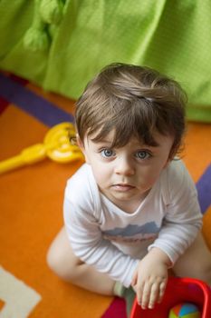 Baby playing with toys on his room