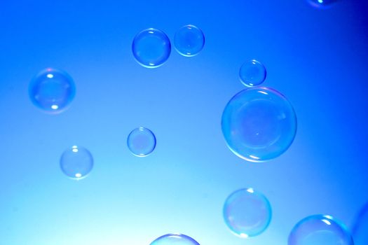 Soap bubles on blue background